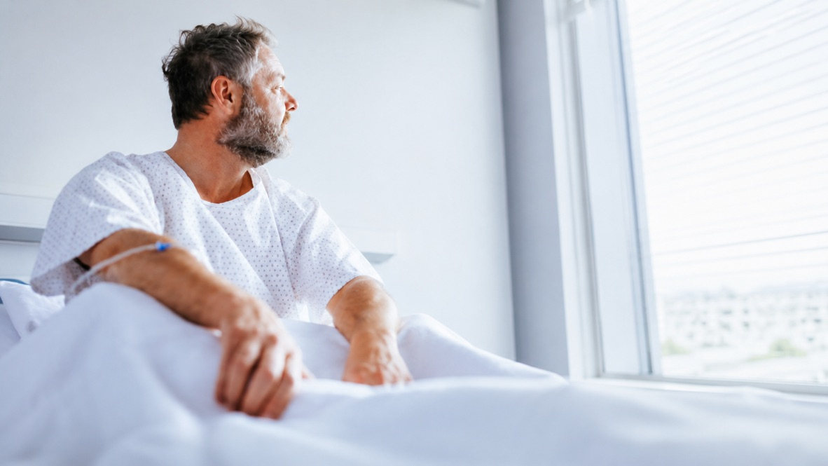 Patient looking out a hospital window in contemplation